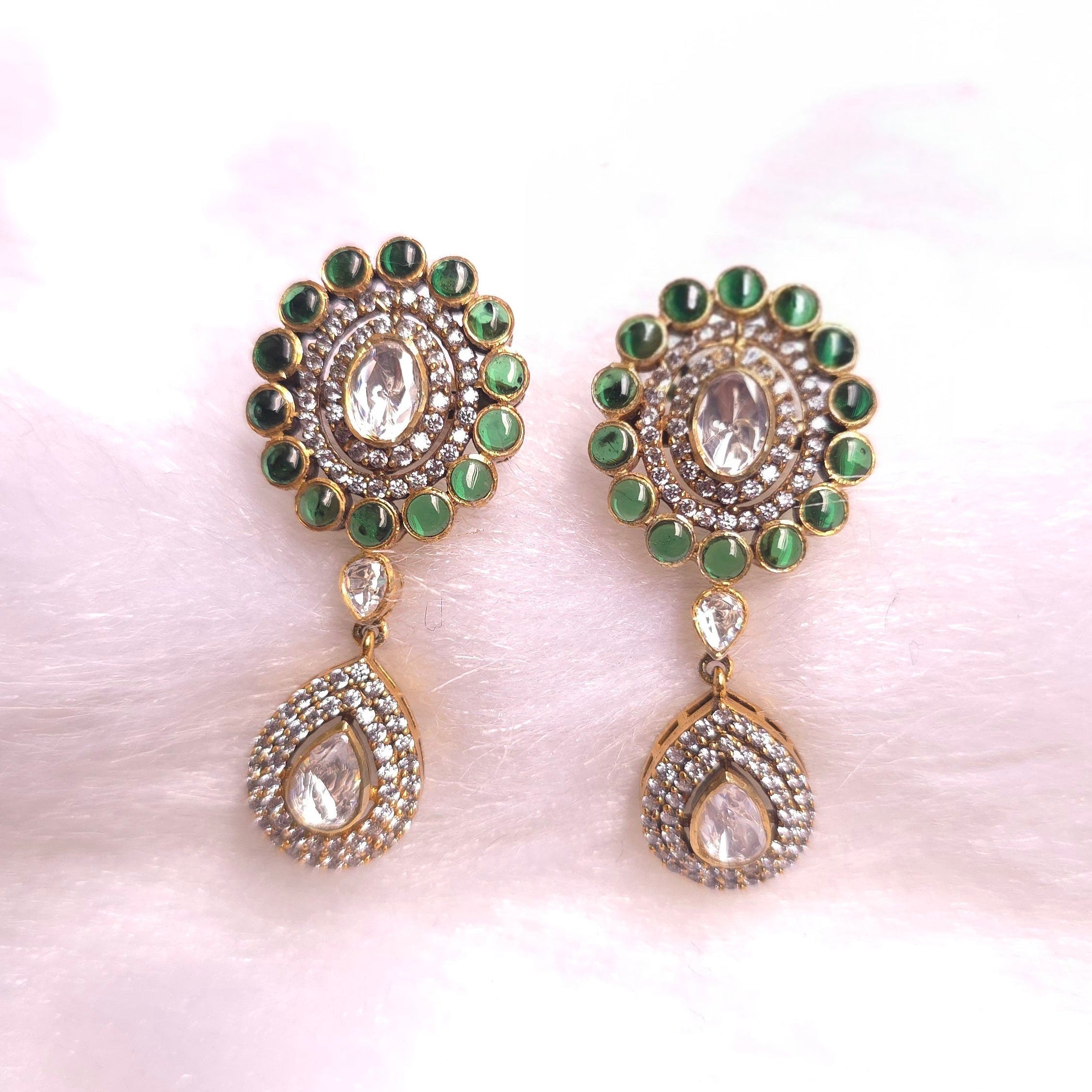 Emerald Drop Earrings featuring dazzling emeralds and intricate detailing in a stunning drop design.