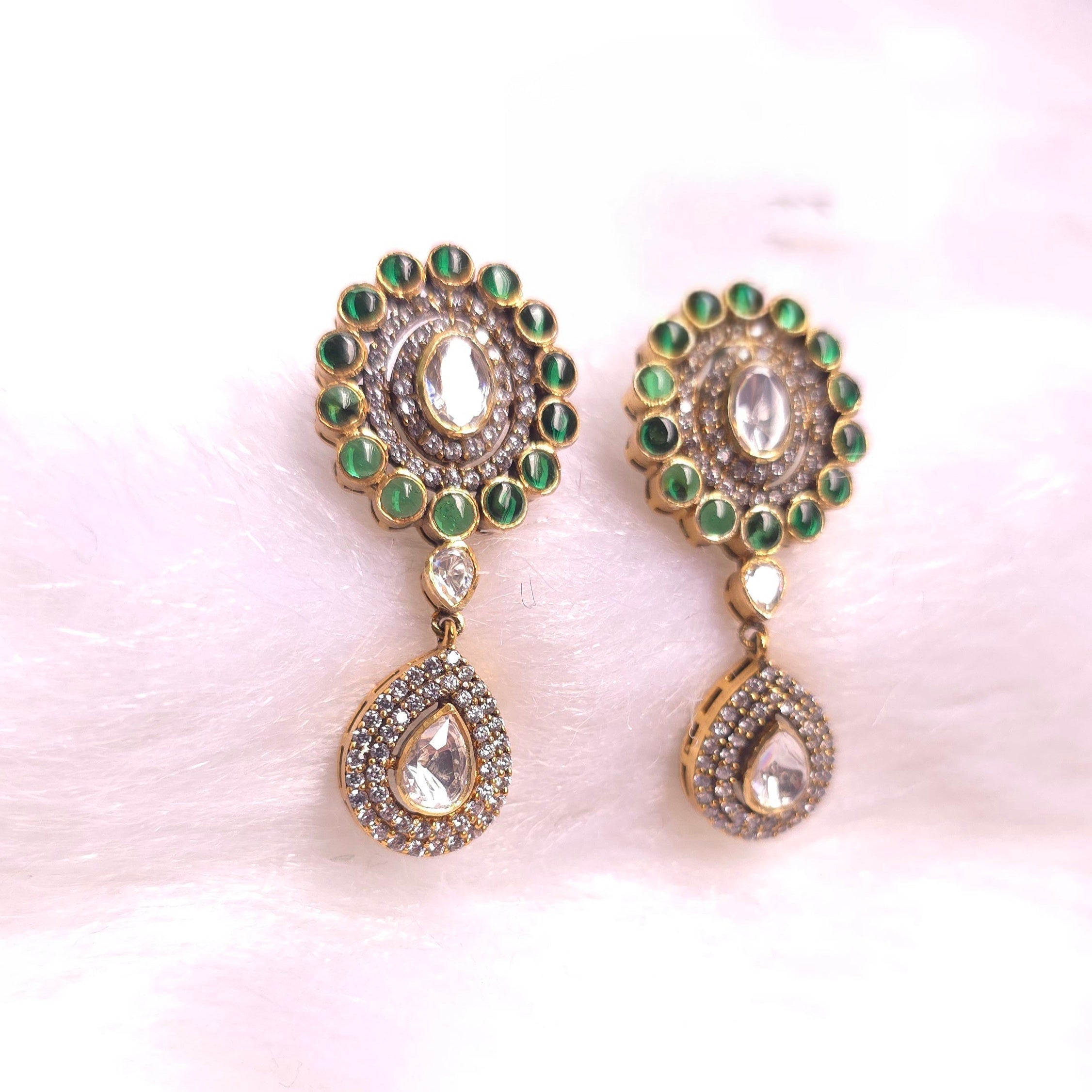 Emerald Drop Earrings showcasing deep green hues with intricate golden detailing, perfect for elegant occasions.